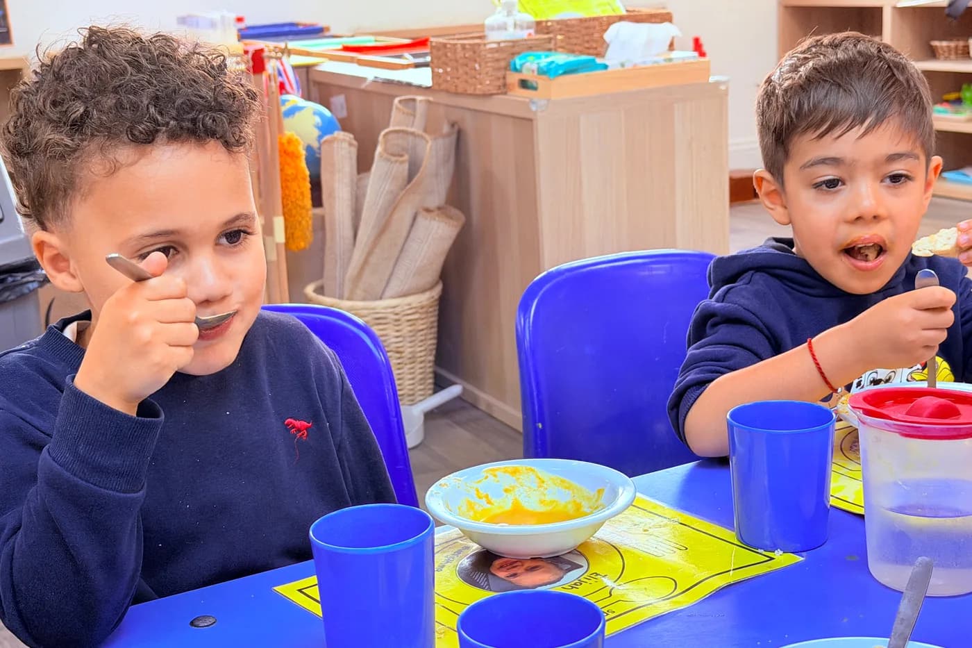 Friends enjoying a healthy snack together at Blue Nest Montessori Borehamwood