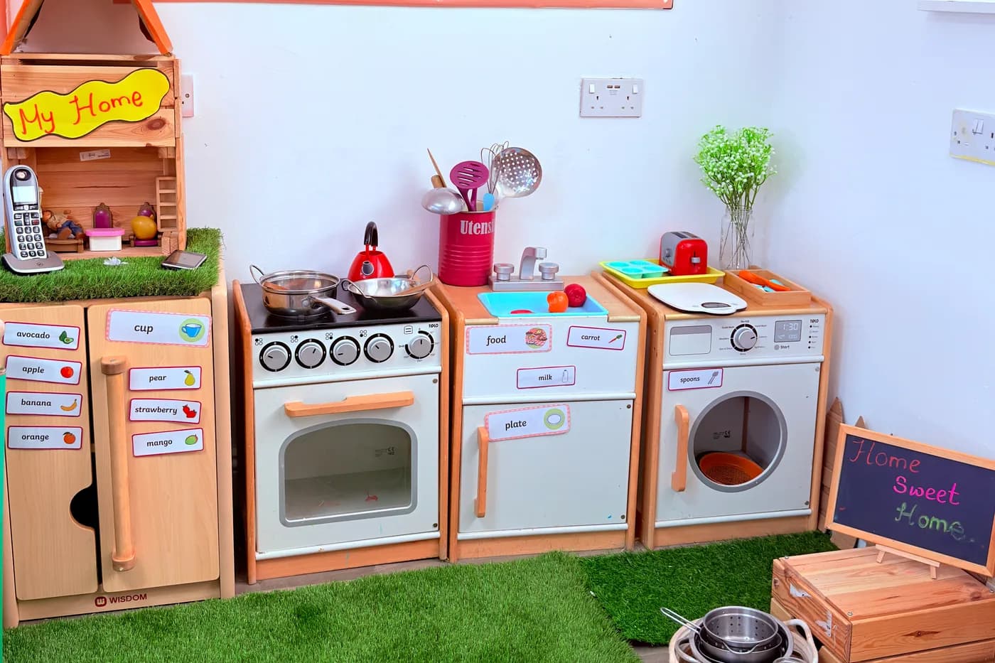 The home-corner role-play kitchen at Blue Nest Montessori Borehamwood