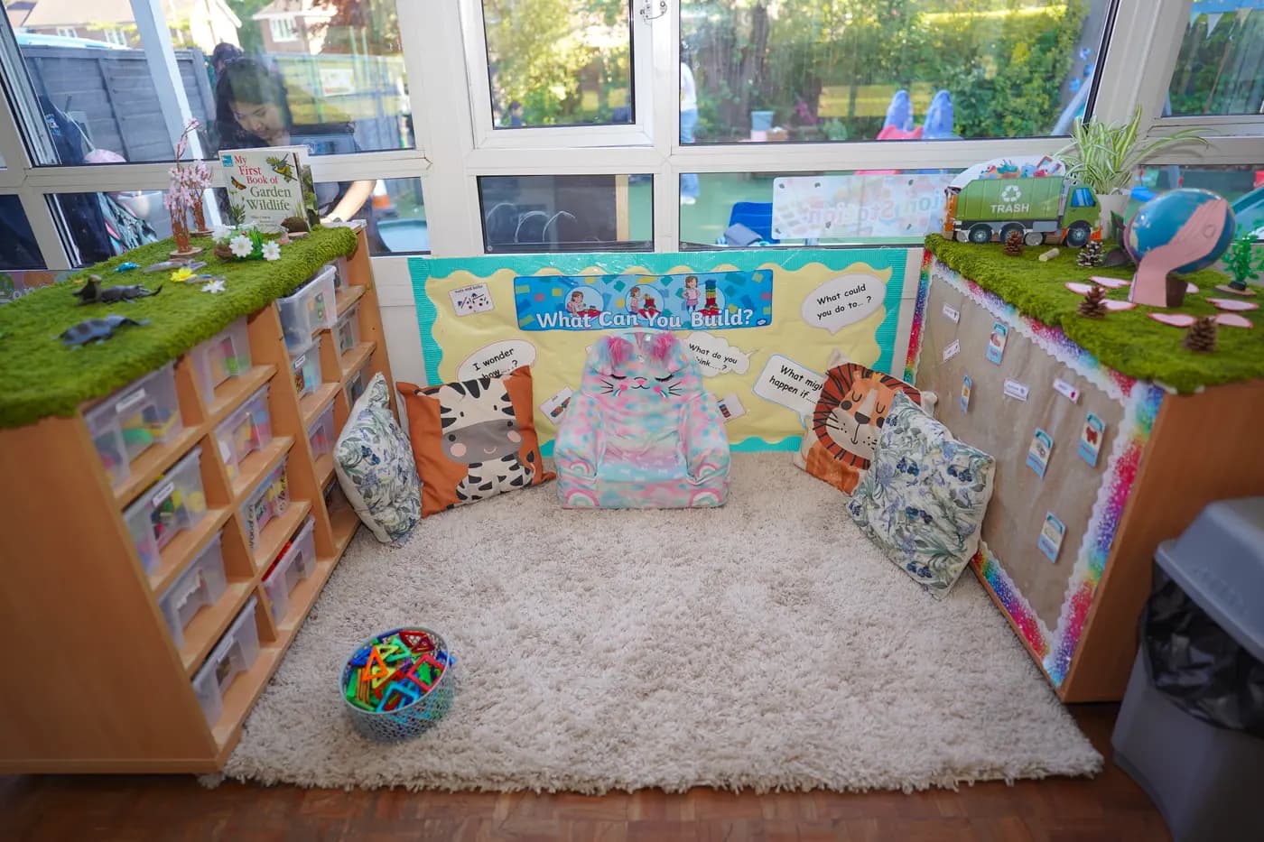 Cozy reading nook with animal cushions at Blue Nest Pinner