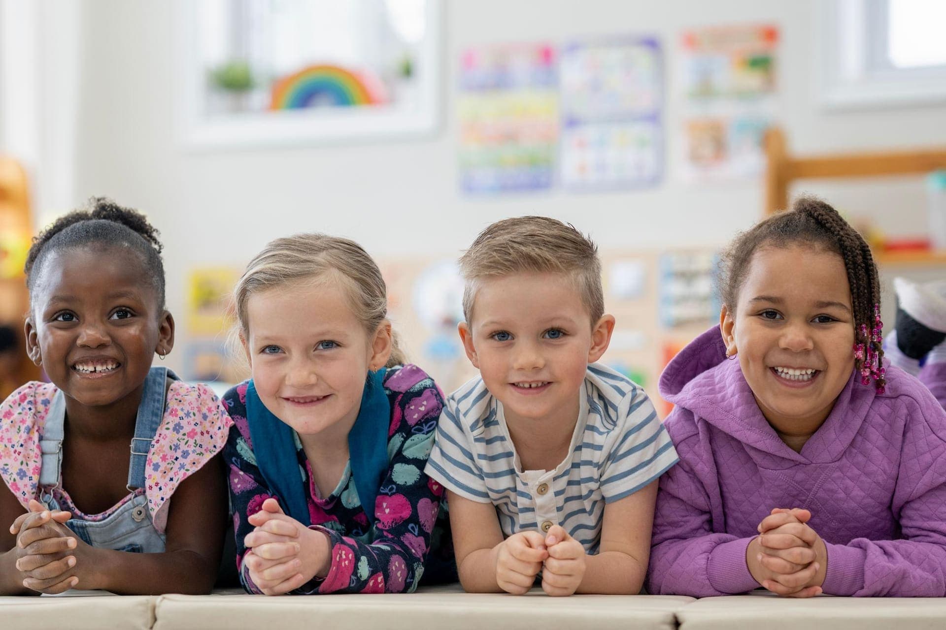 Blue Nest Montessori educator playing with children